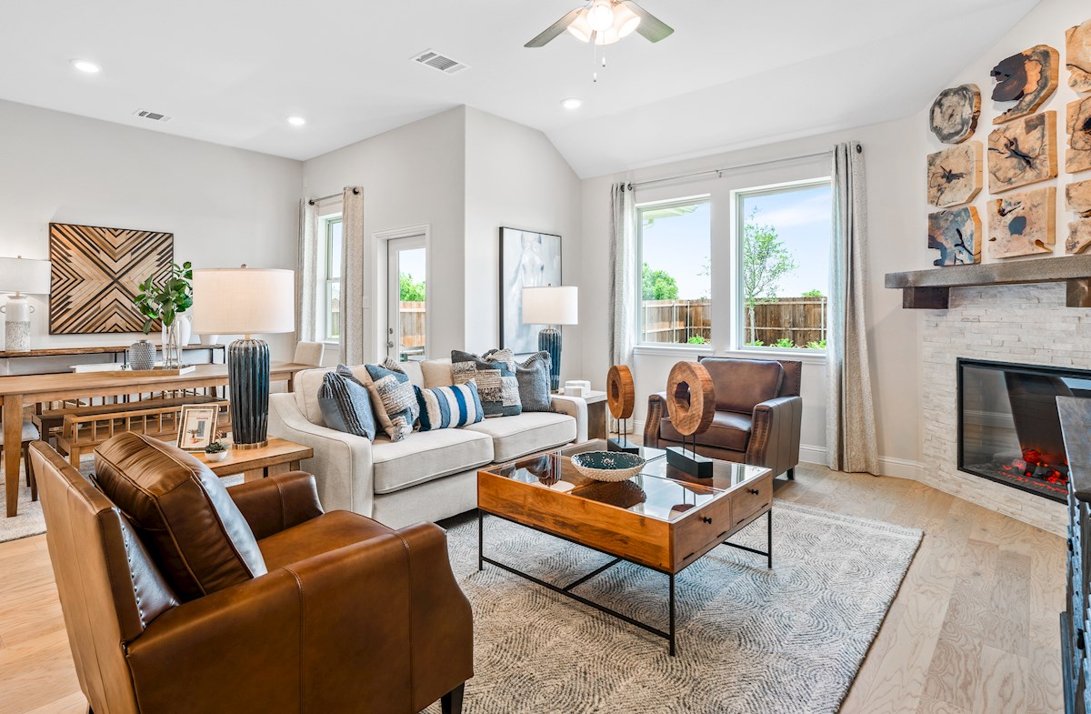 open great room with wood floors and fireplace