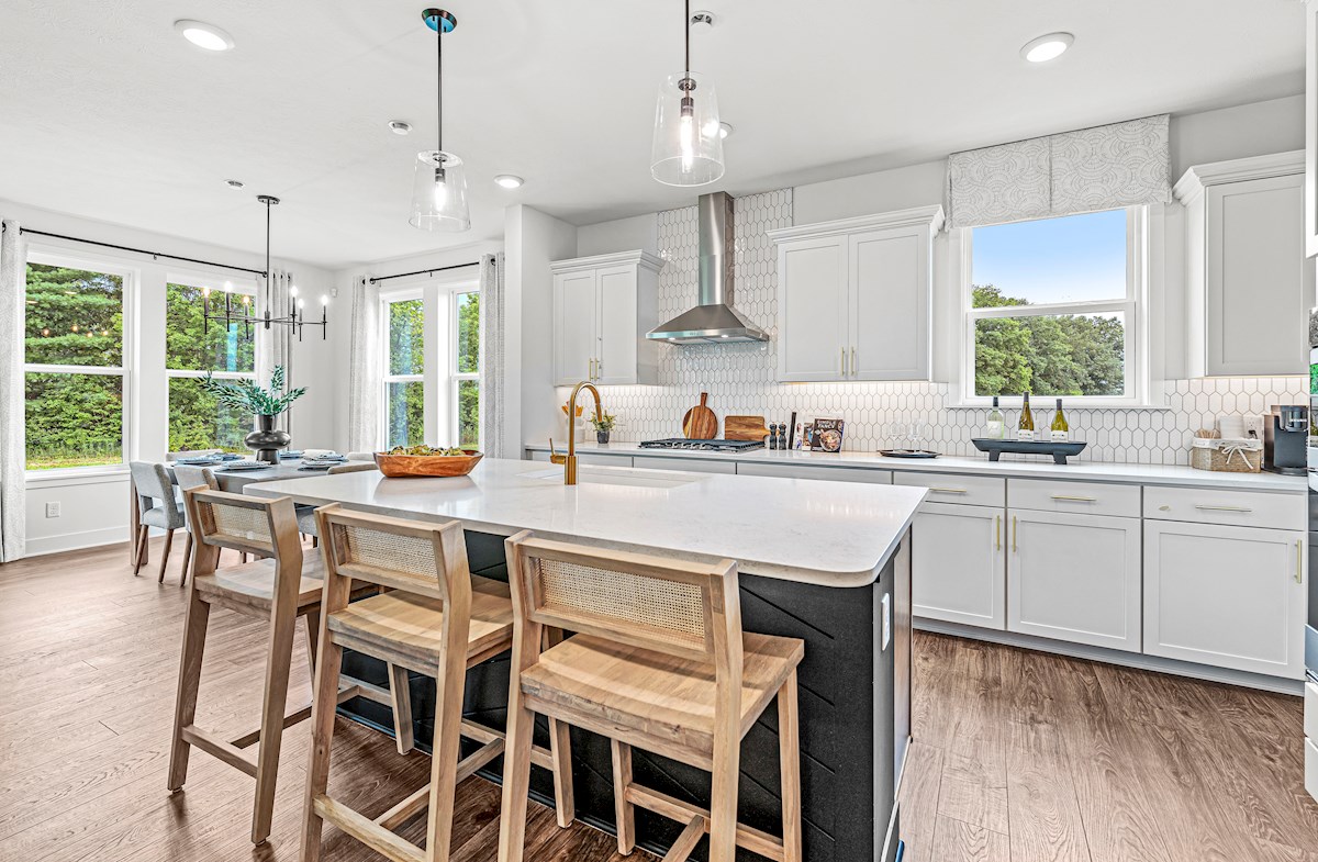 kitchen with spacious island and bar stools