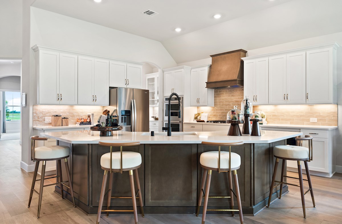 open kitchen with white cabinets and large island