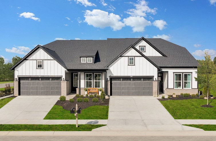duets with farmhouse exterior with 2-car garages