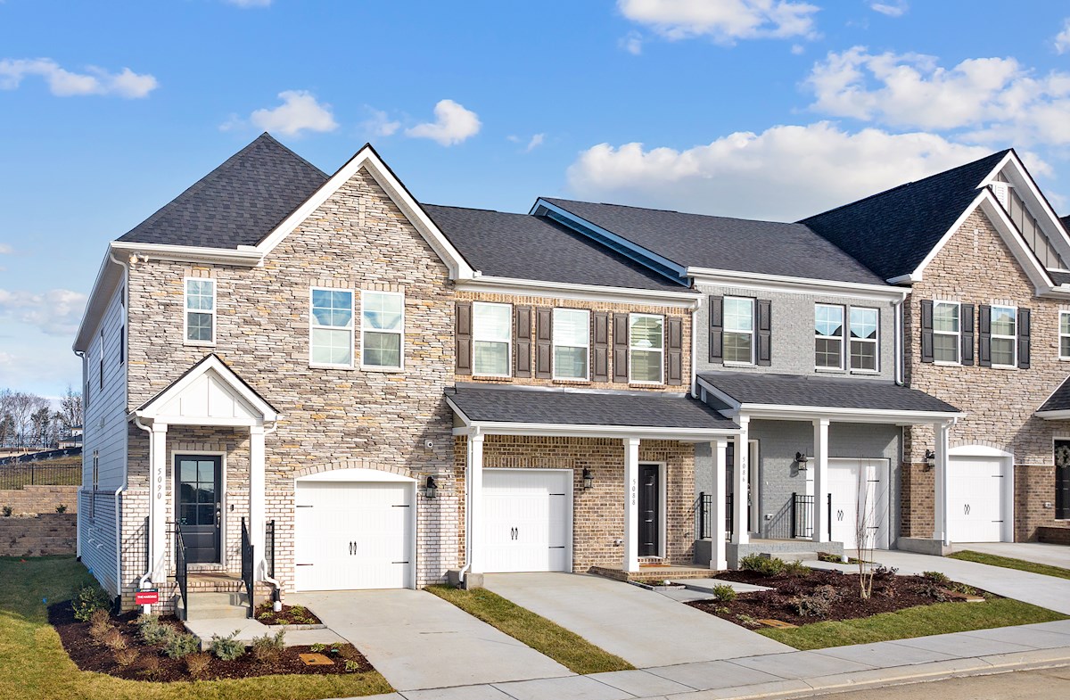 exterior of 3 brick townhome units