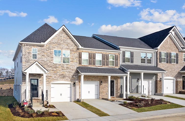 exterior of 3 brick townhome units