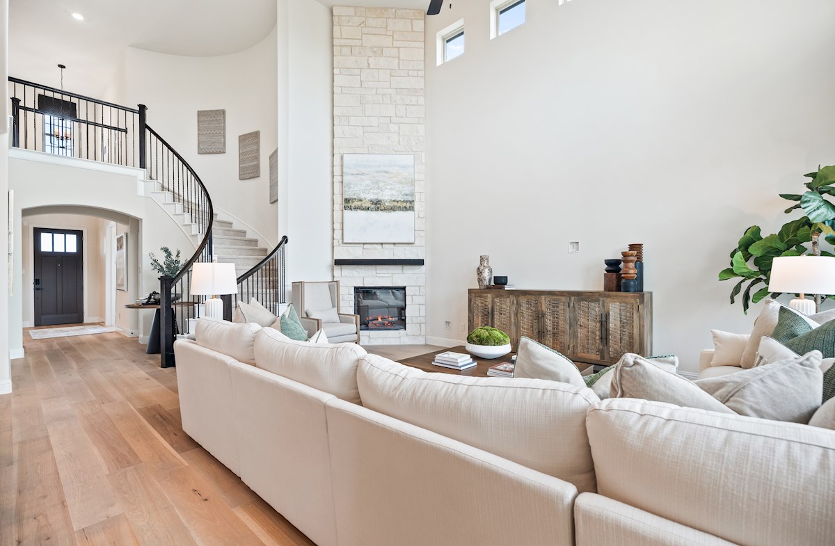 great room with wood floors and tall ceilings