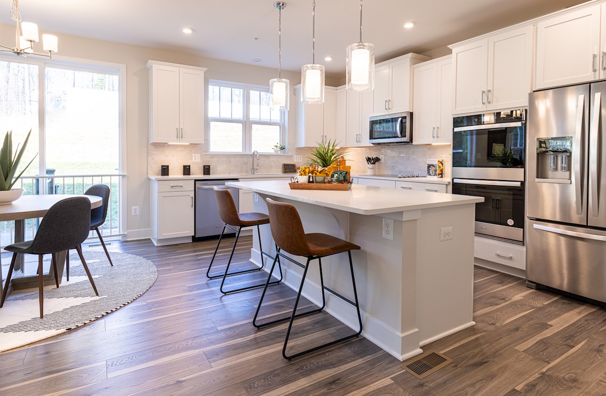 kitchen in white with stainless steel appliances