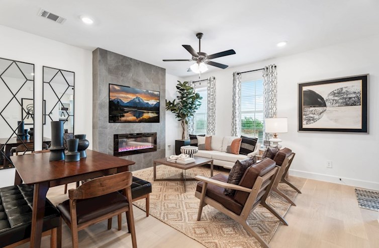 Rosemary open great room with fireplace and wood floors