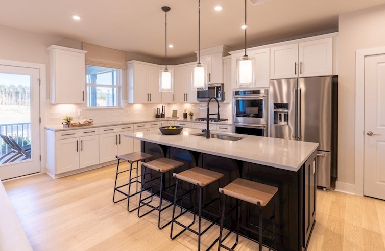 Heron kitchen with white cabinets and a center island