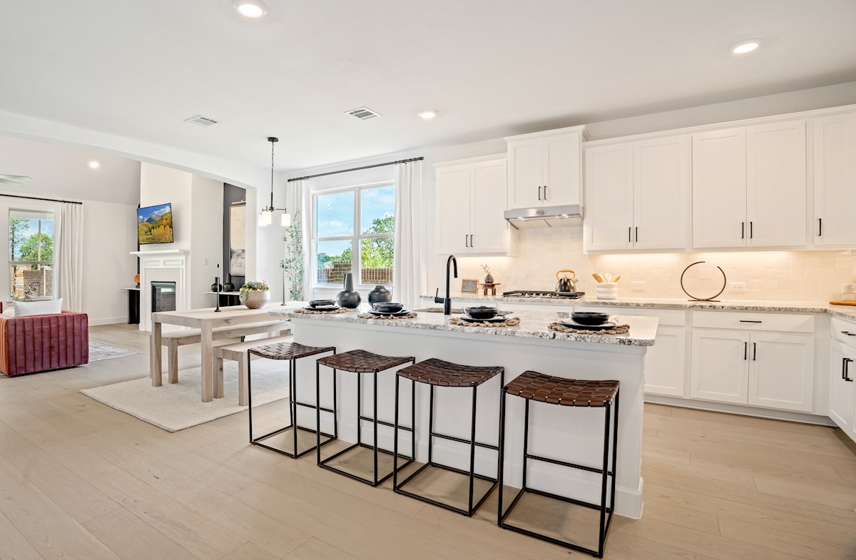 kitchen with large island and white cabinets 