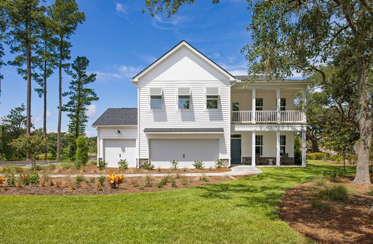 two-story coastal white home with blue door