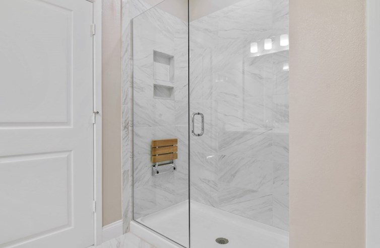 Bradford semi-frameless primary shower with folding seat