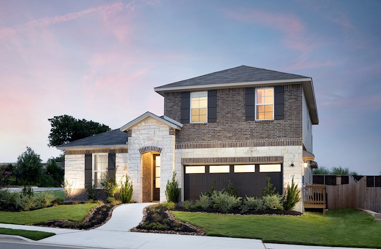 exterior with brick, stone & grass