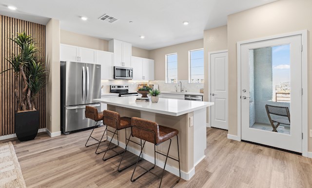 kitchen with 3 bars stools and white countertop For more information on this video, review content in slideshow, overview, and details & features section