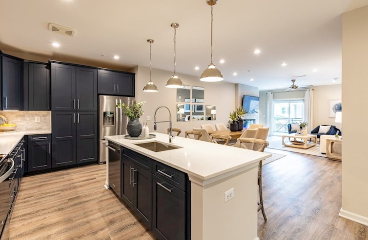 Dorset kitchen connects to the open living room with designer floors
