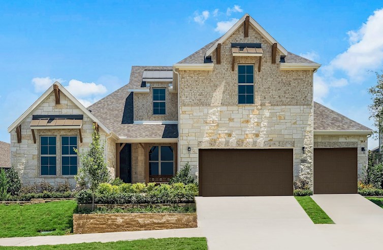 brick and stone exterior with small tree