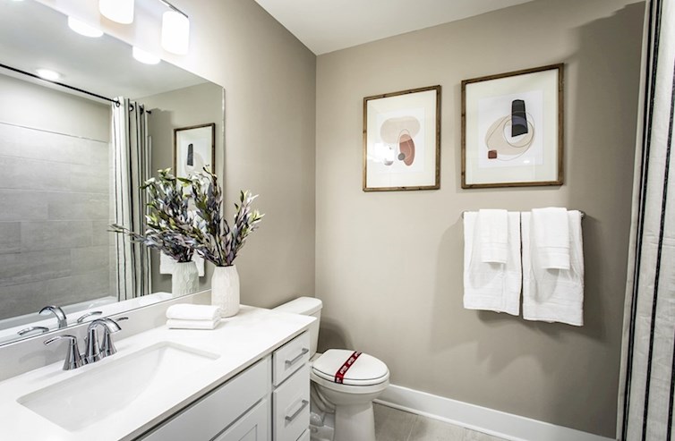 Dorset secondary bathroom with gray cabinets and matte black hardware