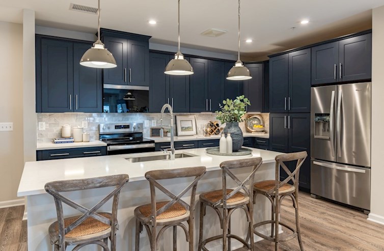 Dorset kitchen with dark blue cabinets and granite counters