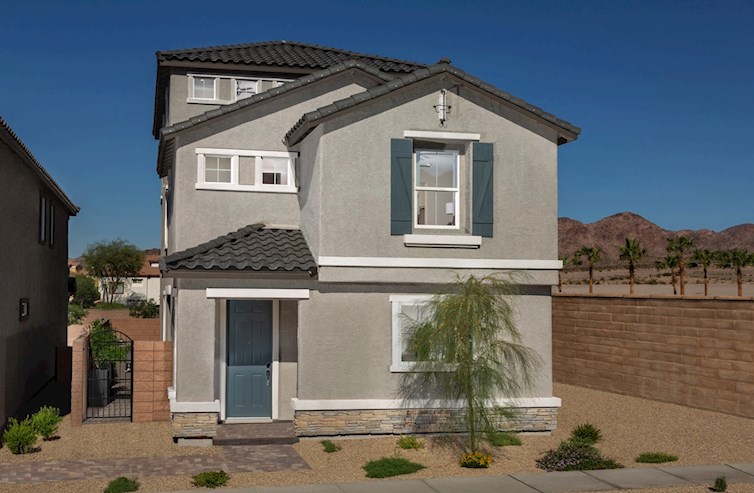 three-story home with desert landscaping