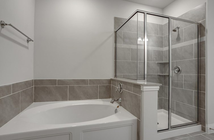Dorset primary bathroom with soaking tub and walk-in shower
