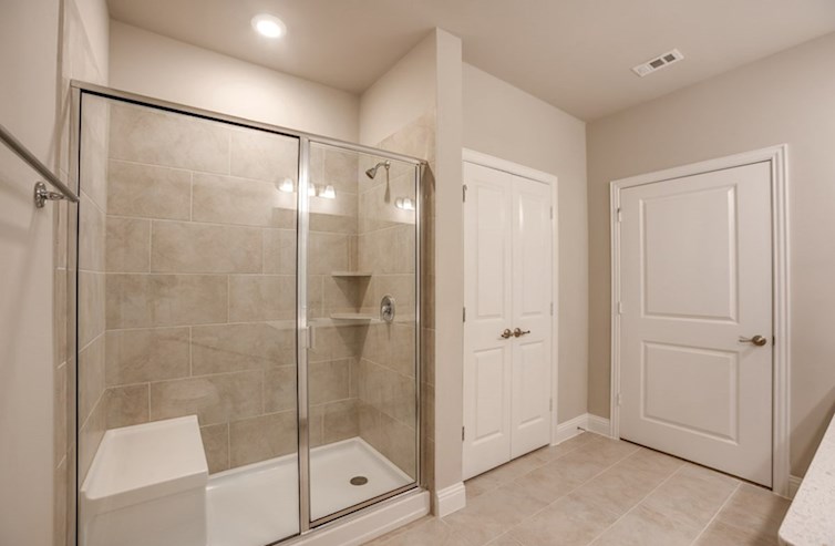 Dorset primary bathroom with large walk-in shower with seat