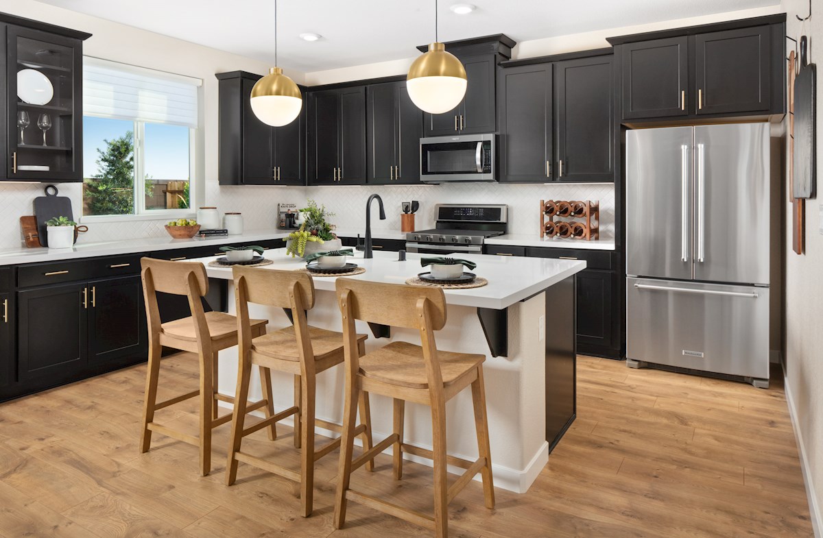 kitchen with espresso cabinets & two brass lights