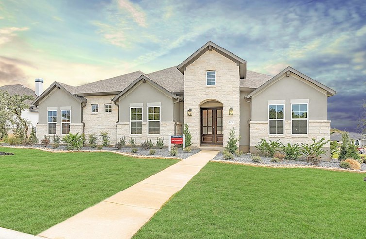 exterior with white stucco, stone & 3-car garage