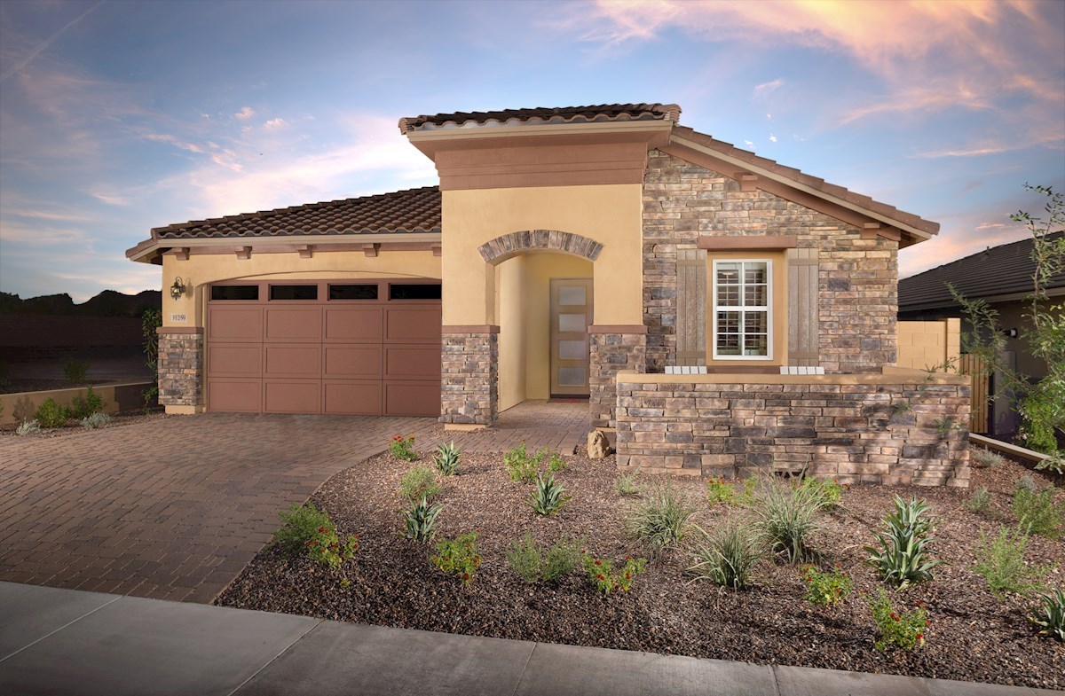stucco home with desert landscaping