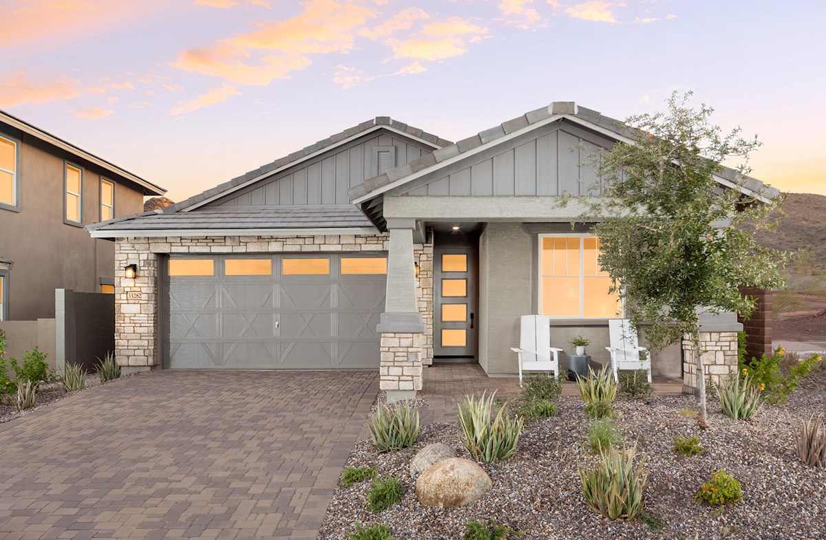 stucco home with paved driveway