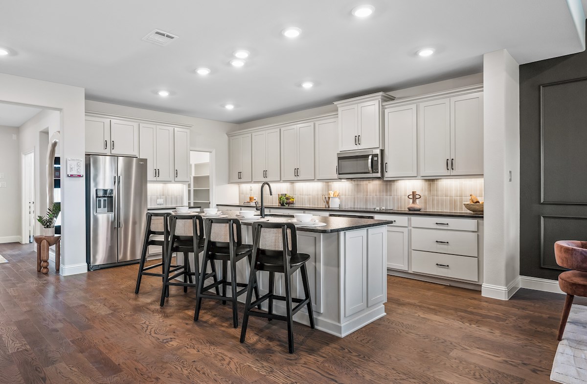 kitchen with white cabinets and hardwood floors
