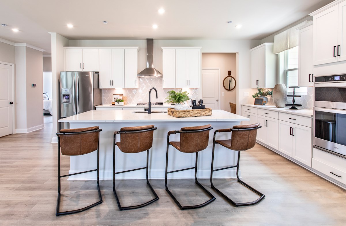kitchen with white cabinets and large island