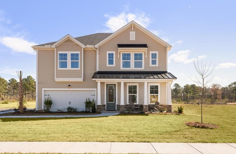 two-story home with metal roof accents