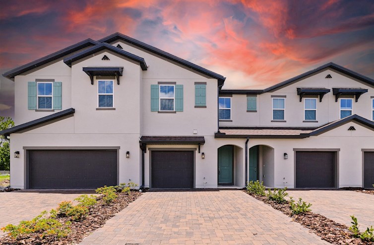 front exterior of townhome with accent shutters