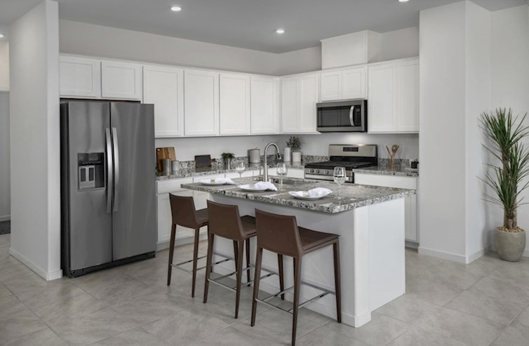 Bedford kitchen with white cabinets and stainless steel appliances