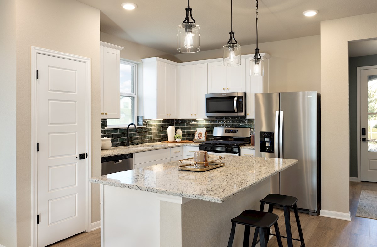 kitchen with green backsplash & island