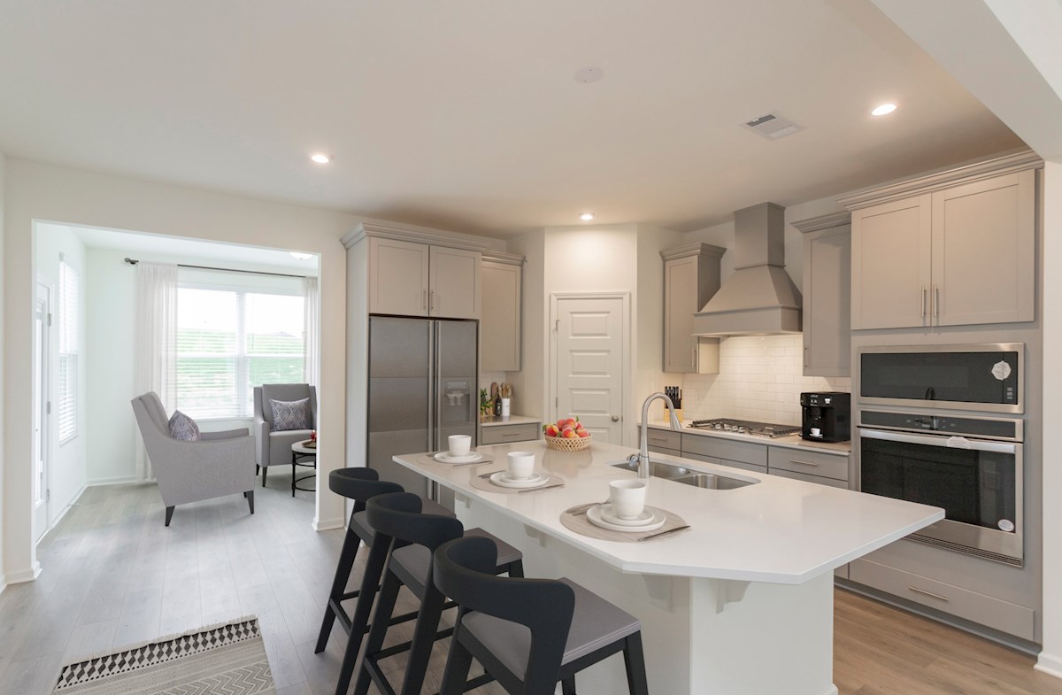 kitchen with white cabinets and an island