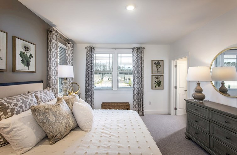 Wiltshire secondary bedroom with natural light and neutral carpet
