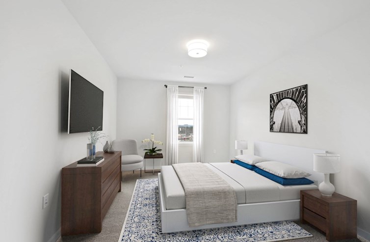 Denmark carpeted secondary bedroom with single double-hung window and flush mounted light fixture