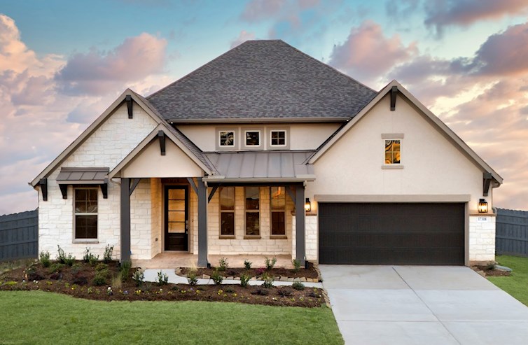 exterior with stucco, stone & 2-car garage