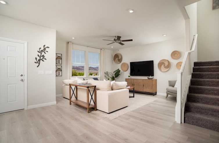 Cambridge furnished living room with ceiling fan, window and upgraded tile