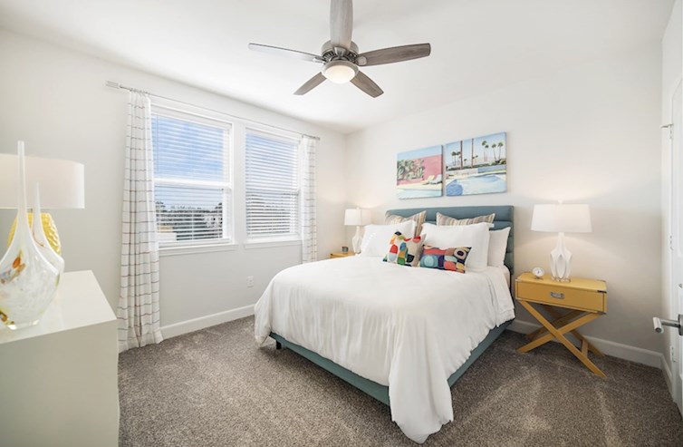 Sherwood secondary bedroom with carpet floors and ceiling fan 