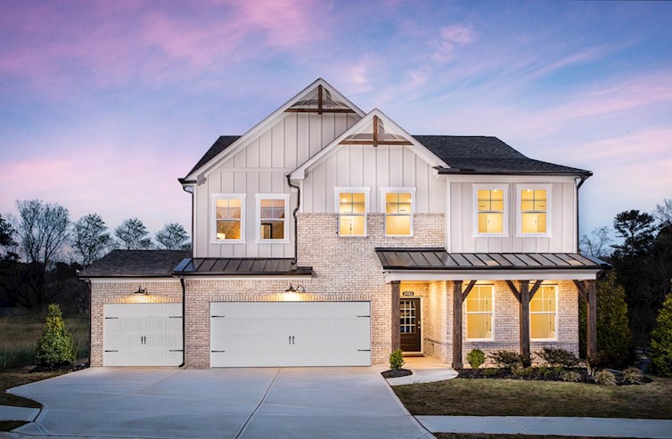 Home with 3-car garage and brick exterior