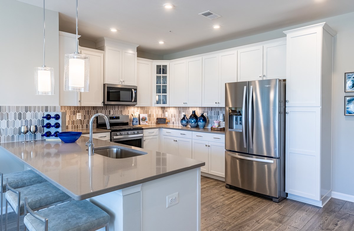 kitchen with granite countertops & a breakfast bar