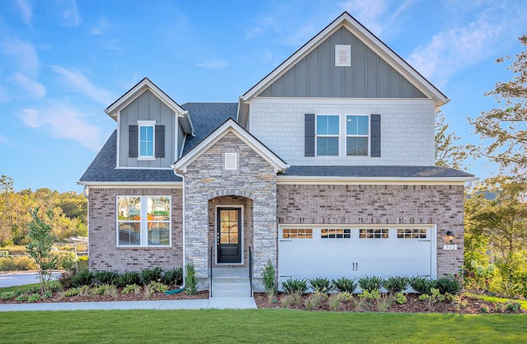 front exterior of home with stone entry and garage