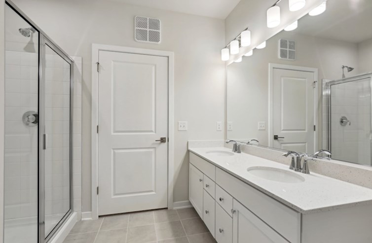 Aspen primary bath with double sinks and oversized showers