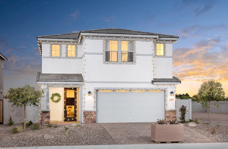 two-story home with hanging Christmas lights