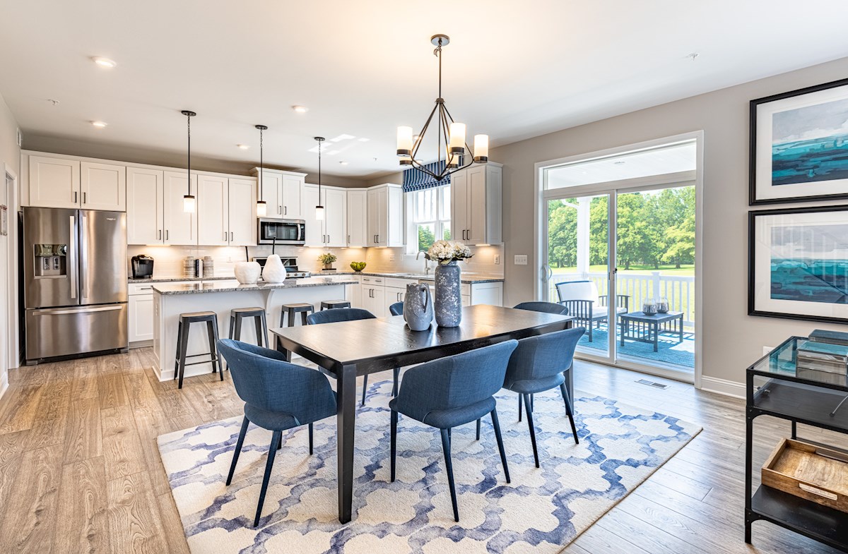 dining area and kitchen with white cabinets