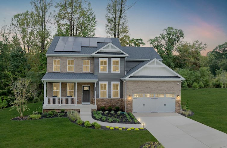 single-family home with 2-car garage at twilight