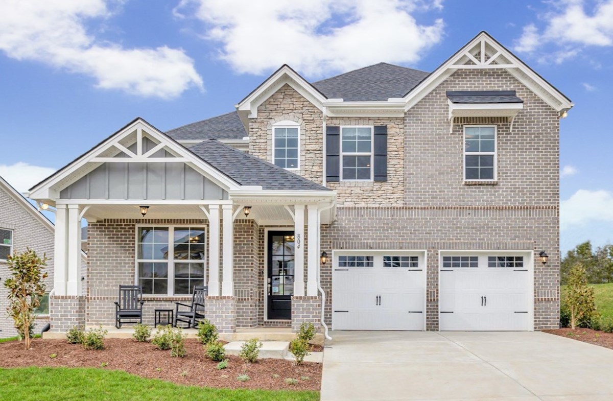 home exterior with front porch seating and garage