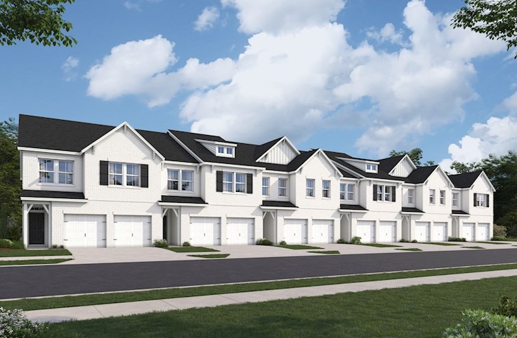 white brick townhome exterior with garages