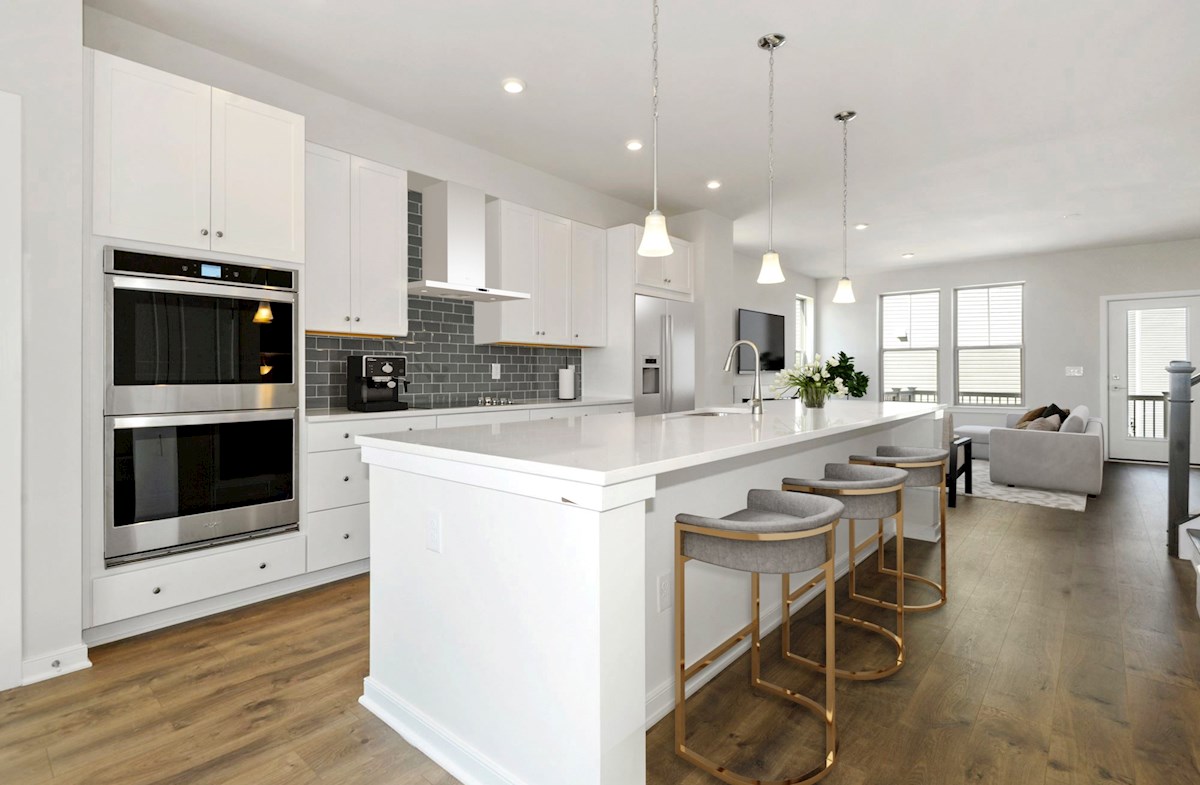 kitchen with white center island and gray chairs