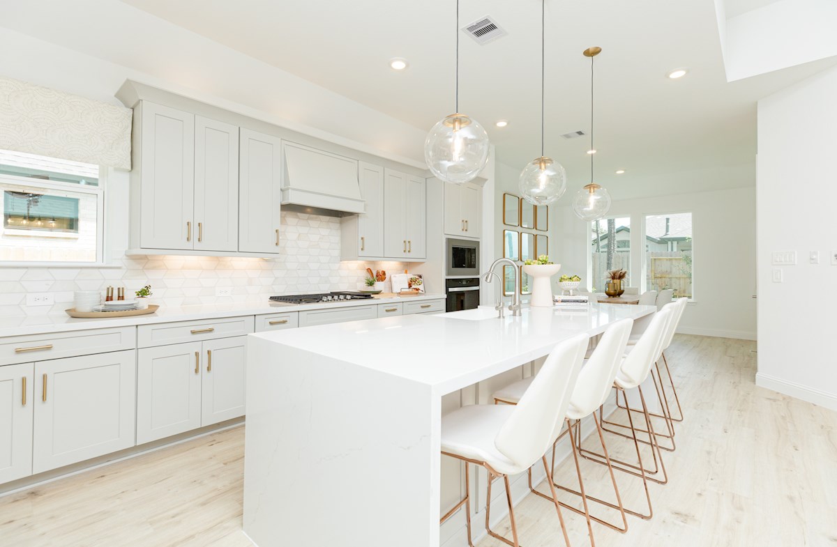 gray and white kitchen with oversized island