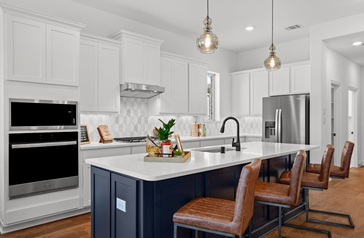 open kitchen with large island and hardwood floors